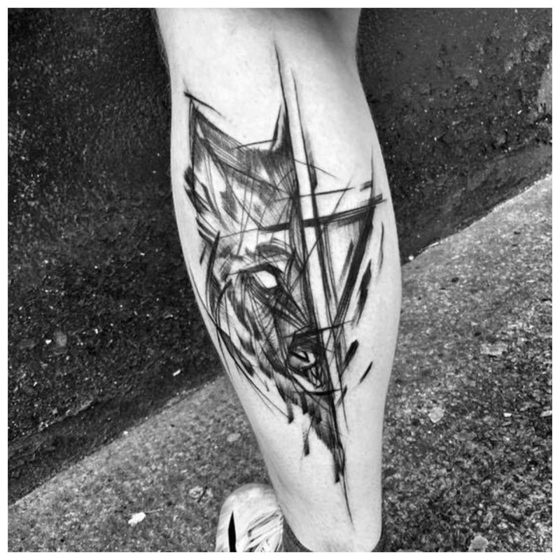 Tatouage de loup sur la jambe d'un homme